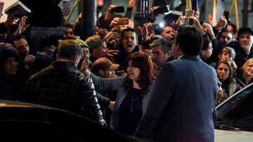 Argentina's Vice-President Cristina Fernandez (C) -- on trial for alleged corruption -- greets supporters demonstrating outside her residence in Buenos Aires, on August 29, 2022. - Fernandez de Kirchner, 69, is accused of fraudulently awarding public works contracts in her stronghold in Patagonia, and prosecutors have asked that she face 12 years in jail and a lifetime ban from politics. (Photo by Luis ROBAYO / AFP) (Photo by LUIS ROBAYO/AFP via Getty Images)