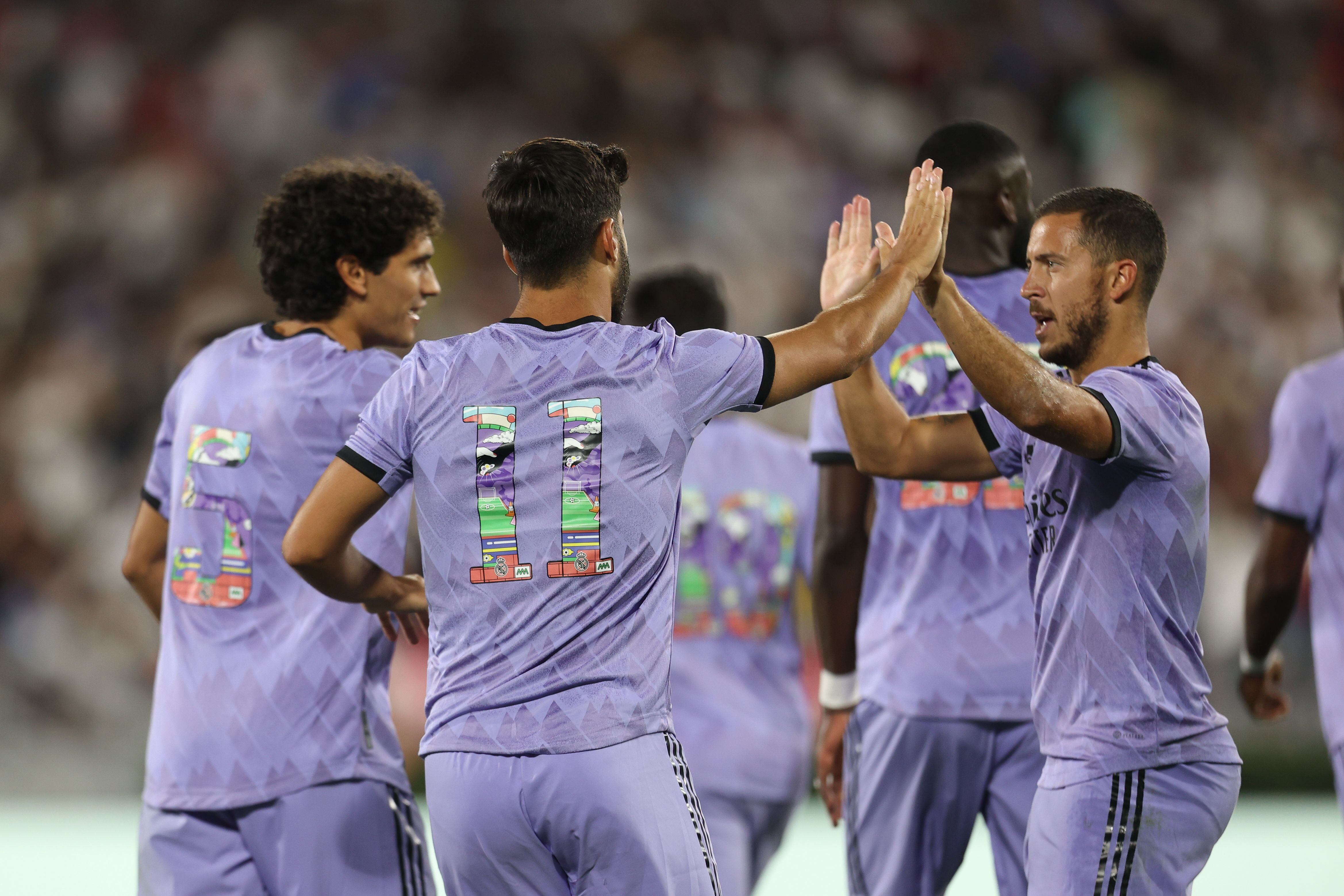 PASADENA, CA - JULY 30: Marco Asensio Willemsen #11 of Real Madrid celebrates with his teammates after scoring their second goal during the preseason friendly match between Real Madrid and Juventus FC at Rose Bowl on July 30, 2022 in Pasadena, California. (Photo by Omar Vega/Getty Images)