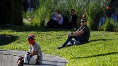 People take a sunbath as the outbreak of the coronavirus disease (COVID-19) continues, in Buenos Aires, Argentina March 31, 2021. REUTERS/Agustin Marcarian