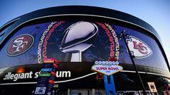A Welcome To Las Vegas Super Bowl LVIII sign stands at sunrise outside of Allegiant Stadium wrapped with the logos of the Kansas City Chiefs and San Francisco 49ers with the NFL Lombardi Trophy ahead of Super Bowl LVIII in Las Vegas, Nevada, on February 11, 2024. (Photo by Patrick T. Fallon / AFP)