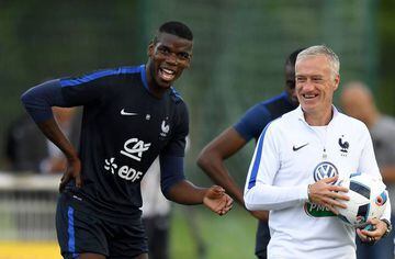Deschamps jokes with Paul Pogba at the end of a training session.