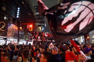 TORONTO, ON - JUNE 13: Toronto Raptors fans celebrate after the team beat the Golden State Warriors in Game Six of the NBA Finals, on June 13, 2019 in Toronto, Canada.   