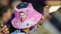 A fan wears a Lionel Messi bucket hat