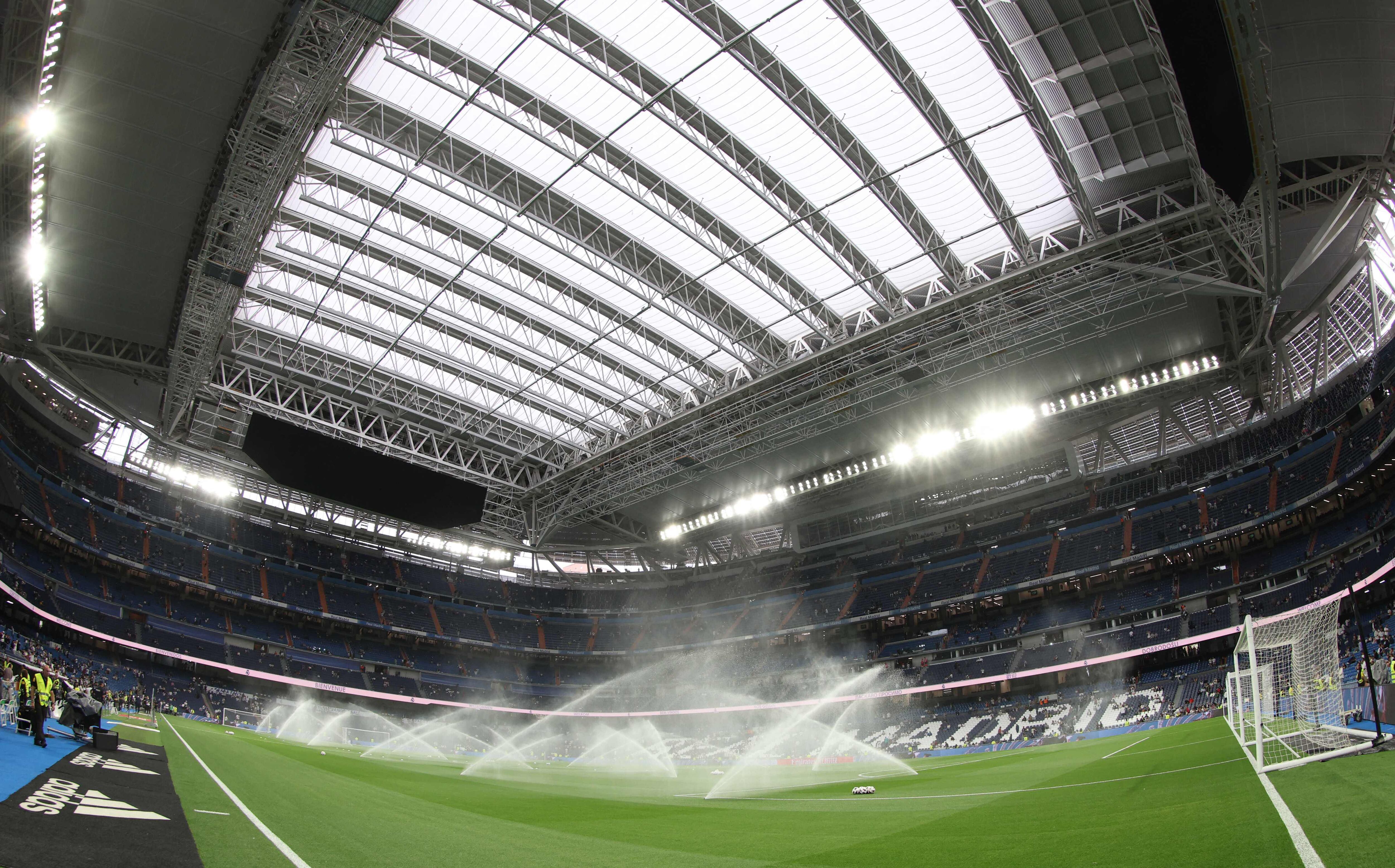 (FILES) Picture shows a general view of the Santiago Bernabeu stadium with its operable roof closed due to the rainy weather ahead of the Spanish Liga football match between Real Madrid CF and Getafe CF in Madrid on September 2, 2023. The NFL will play a regular season game at Real Madrid's Santiago Bernabeu Stadium during the 2025 season, the league said on February 9, 2024. (Photo by Thomas COEX / AFP)