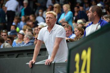 July 12, 2015 German tennis coach Boris Becker standing in the players box on Wimbledon's Centre Court as he watches the men's singles final match between Serbia's Novak Djokovic and Switzerland's Roger Federer.