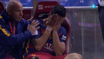 Luis Suárez injured then visibly distressed on the bench.