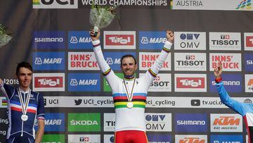 Cycling - UCI Road Cycling World Championships - Innsbruck-Tirol, Austria - September 30, 2018  First placed Alejandro Valverde of Spain (C), second placed Romain Bardet of France (L) and third placed Michael Woods of Canada (R) celebrate during the medal