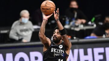 NEW YORK, NEW YORK - JUNE 07:  Kyrie Irving #11 of the Brooklyn Nets attempts a jump shot against the Milwaukee Bucks in Game Two of the Second Round of the 2021 NBA Playoffs at Barclays Center on June 07, 2021 in New York City. NOTE TO USER: User express