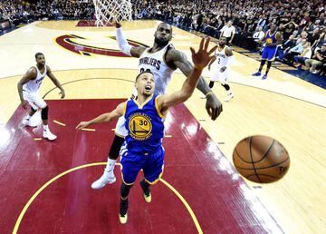 Cleveland Cavaliers forward LeBron James blocks a shot by Golden State Warriors guard Stephen Curry during the fourth quarter in game six of the NBA Finals