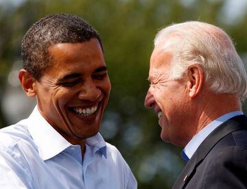 FILE PHOTO: Democratic presidential nominee Senator Barack Obama (D-IL) and his vice presidential running mate Senator Joe Biden (D-DE) share a laugh on stage during a campaign rally in Detroit, Michigan, U.S., September 28, 2008. REUTERS/Jason Reed/File 