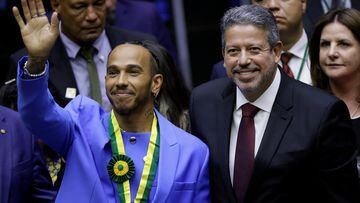 British Formula One racing driver, Lewis Hamilton gestures next to President of the Chamber Arthur Lira, after he received the title of honorary citizen of Brazil at the Chamber of Deputies in Brasilia, Brazil November 7, 2022. REUTERS/Adriano Machado