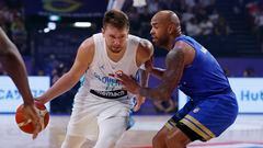 Basketball - FIBA World Cup 2023 - First Round - Group F - Slovenia v Venezuela - Okinawa Arena, Okinawa, Japan - August 26, 2023 Slovenia's Luka Doncic in action with Venezuela's Gregory Vargas REUTERS/Issei Kato