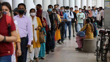 People wearing protective face masks stand in a line to enter a metro station amidst the spread of the coronavirus disease (COVID-19), in New Delhi, India, September 14, 2020. REUTERS/Anushree Fadnavis