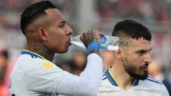 Boca Juniors' Colombian forward Sebastian Villa (L) drinks water next to his teammate forward Dario Benedetto before their Argentine Professional Football League Tournament 2022 match against San Lorenzo at Nuevo Gasometro stadium in Buenos Aires, on July 9, 2022. (Photo by ALEJANDRO PAGNI / AFP) (Photo by ALEJANDRO PAGNI/AFP via Getty Images)