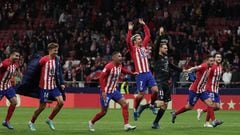 Atletico players celebrate their win at the end of the Spanish league football match between Club Atletico de Madrid and Villarreal CF at the Civitas Metropolitano stadium in Madrid on November 12, 2023. (Photo by Thomas COEX / AFP)