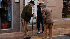 Pensioners compare their walking sticks in a street in Ronda, Spain, January 30, 2024. REUTERS/Jon Nazca
