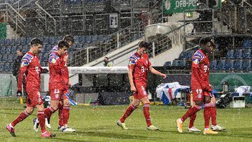 Bayern Munich&#039;s players leave the pitch after losing in a penalty shoot-out following extra time during the German Cup (DFB Pokal) second round football match between Holstein Kiel and FC Bayern Munich in Kiel, northern Germany, on January 13, 2021. 