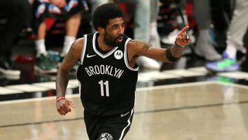 FILE PHOTO: Jun 5, 2021; Brooklyn, New York, USA; Brooklyn Nets point guard Kyrie Irving (11) reacts after making a basket against the Milwaukee Bucks during the second quarter of game one in the Eastern Conference semifinals of the 2021 NBA Playoffs at B