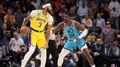 Anthony Davis #3 of the Los Angeles Lakers handles the ball against Deandre Ayton #22 of the Phoenix Suns during the first half of the NBA game at Footprint Center on November 22, 2022 in Phoenix, Arizona.