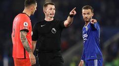 LEICESTER, ENGLAND - JANUARY 21: Match referee Thomas Bramall in discussion with Lewis Dunk of Brighton & Hove Albion and James Maddison of Leicester City during the Premier League match between Leicester City and Brighton & Hove Albion at The King Power Stadium on January 21, 2023 in Leicester, United Kingdom. (Photo by James Williamson - AMA/Getty Images)