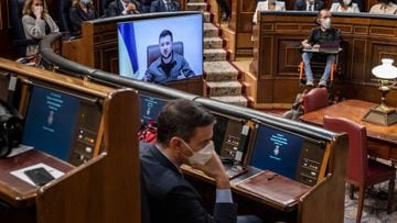 MADRID, SPAIN - APRIL 05: Ukrainian president Volodymyr Zelenskiy (C) addresses the Spanish parliament via video link as the Spanish Prime Minister Pedro Sanchez (bottom) listens amid other diputies on April 05, 2022 in Madrid, Spain. Zelenskiy has been making a virtual world tour in recent weeks, lobbying foreign governments by video to help Ukraine defend itself against Russia's invasion.  (Photo by Pablo Blazquez Dominguez/Getty Images)