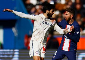 Lille's Andre Gomes battles with Paris St Germain's Sergio Ramos.