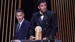 Real Madrid's English midfielder Jude Bellingham (R) speaks on stage as he recieves with the Kopa Trophy for best under-21 player next to Former Belgian midfielder Eden Hazard during the 2023 Ballon d'Or France Football award ceremony at the Theatre du Chatelet in Paris on October 30, 2023. (Photo by FRANCK FIFE / AFP)