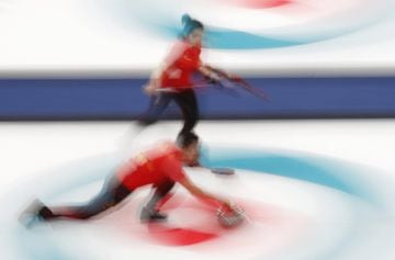 China's Rui Wang and Dexin Ba in the Curling event