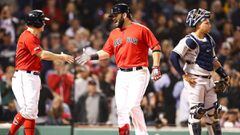 BOSTON, MA - SEPTEMBER 06: Mitch Moreland #18high fives Brock Holt #12 of the Boston Red Sox after hitting a three-run home run in the fourth inning as Gary Sanchez #24 of the New York Yankees looks on at Fenway Park on September 6, 2019 in Boston, Massac
