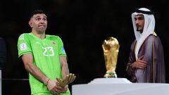 LUSAIL CITY, QATAR - DECEMBER 18: Emiliano Martinez of Argentina celebrates with his Golden Glove Award after the FIFA World Cup Qatar 2022 Final match between Argentina and France at Lusail Stadium on December 18, 2022 in Lusail City, Qatar. (Photo by Alex Livesey - Danehouse/Getty Images)