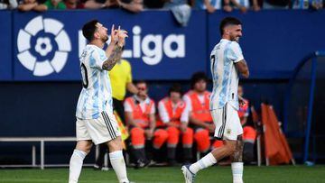 Argentina's forward Lionel Messi (L) celebrates after scoring his team's third goal during the international friendly football match between Argentina and Estonia at El Sadar stadium in Pamplona on June 5, 2022. (Photo by ANDER GILLENEA / AFP) (Photo by ANDER GILLENEA/AFP via Getty Images)
