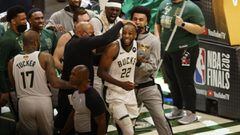Jul 14, 2021; Milwaukee, Wisconsin, USA; Milwaukee Bucks forward Khris Middleton (22) is surrounded by teammates following a basket during the fourth quarter against the Phoenix Suns during game four of the 2021 NBA Finals at Fiserv Forum. Mandatory Credi