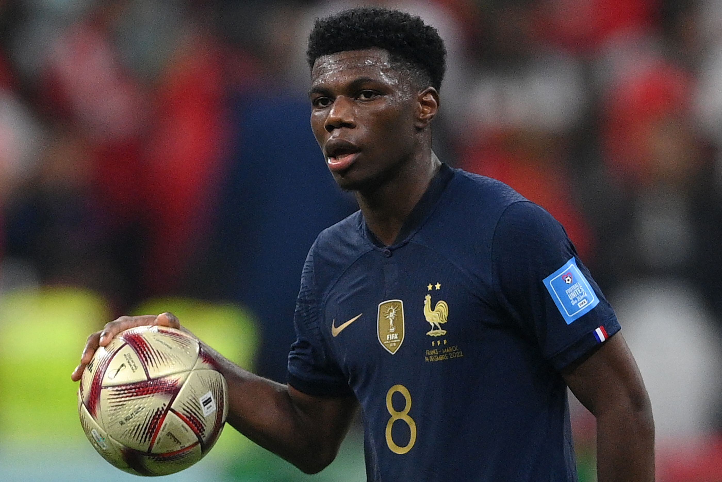 France's midfielder #08 Aurelien Tchouameni looks on during the Qatar 2022 World Cup semi-final football match between France and Morocco at the Al-Bayt Stadium in Al Khor, north of Doha on December 14, 2022. (Photo by FRANCK FIFE / AFP)