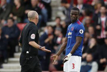 Manchester United's Eric Bailly with referee Mike Dean after he awarded a penalty to Southampton.