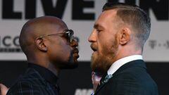 LAS VEGAS, NV - AUGUST 23: Boxer Floyd Mayweather Jr. (L) and UFC lightweight champion Conor McGregor face off during a news conference at the KA Theatre at MGM Grand Hotel &amp; Casino on August 23, 2017 in Las Vegas, Nevada. The two will meet in a super welterweight boxing match at T-Mobile Arena on August 26 in Las Vegas.   Ethan Miller/Getty Images/AFP == FOR NEWSPAPERS, INTERNET, TELCOS &amp; TELEVISION USE ONLY ==