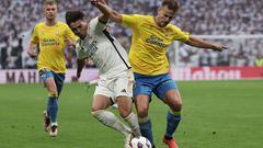 Real Madrid's Spanish forward #21 Brahim Diaz (L) fights for the ball with Las Palmas' Spanish defender #06 Eric Curbelo during the Spanish league football match between Real Madrid CF and UD Las Palmas at the Santiago Bernabeu stadium in Madrid on September 27, 2023. (Photo by Thomas COEX / AFP)
