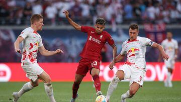 (L to R) Leipzig's German defender Marcel Halstenberg, Liverpool's Colombian midfielder Luis Diaz and Leipzig's Hungarian defender Willi Orban vie for the ball during the friendly football match between German first division Bundesliga club RB Leipzig and Liverpool FC in Leipzig, eastern Germany, on July 21, 2022. (Photo by Ronny HARTMANN / AFP)