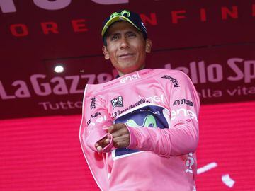 Colombia&#039;s Nairo Quintana of team Movistar celebrates the pink jersey of the overall leader on the podium after winning the 9th stage of the 100th Giro d&#039;Italia, Tour of Italy, cycling race from Montenero di Bisaccia to Blockhaus on May 14, 2017.  Colombia&#039;s Nairo Quintana soared to victory on a dramatic ninth stage of the Giro d&#039;Italia on Sunday to claim the race leader&#039;s pink jersey. Movistar&#039;s Quintana came over the finish line 23secs ahead of Frenchman Thibaut Pinot and Dutchman Tom Dumoulin, to wrest the race lead from Luxembourg&#039;s Bob Jungels.  / AFP PHOTO / Luk BENIES