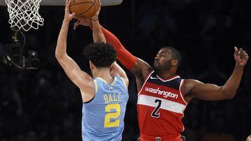 Oct 25, 2017; Los Angeles, CA, USA; Los Angeles Lakers guard Lonzo Ball (2) attempts a shot defended by Washington Wizards guard John Wall (2) during the second quarter at Staples Center. Mandatory Credit: Kelvin Kuo-USA TODAY Sports