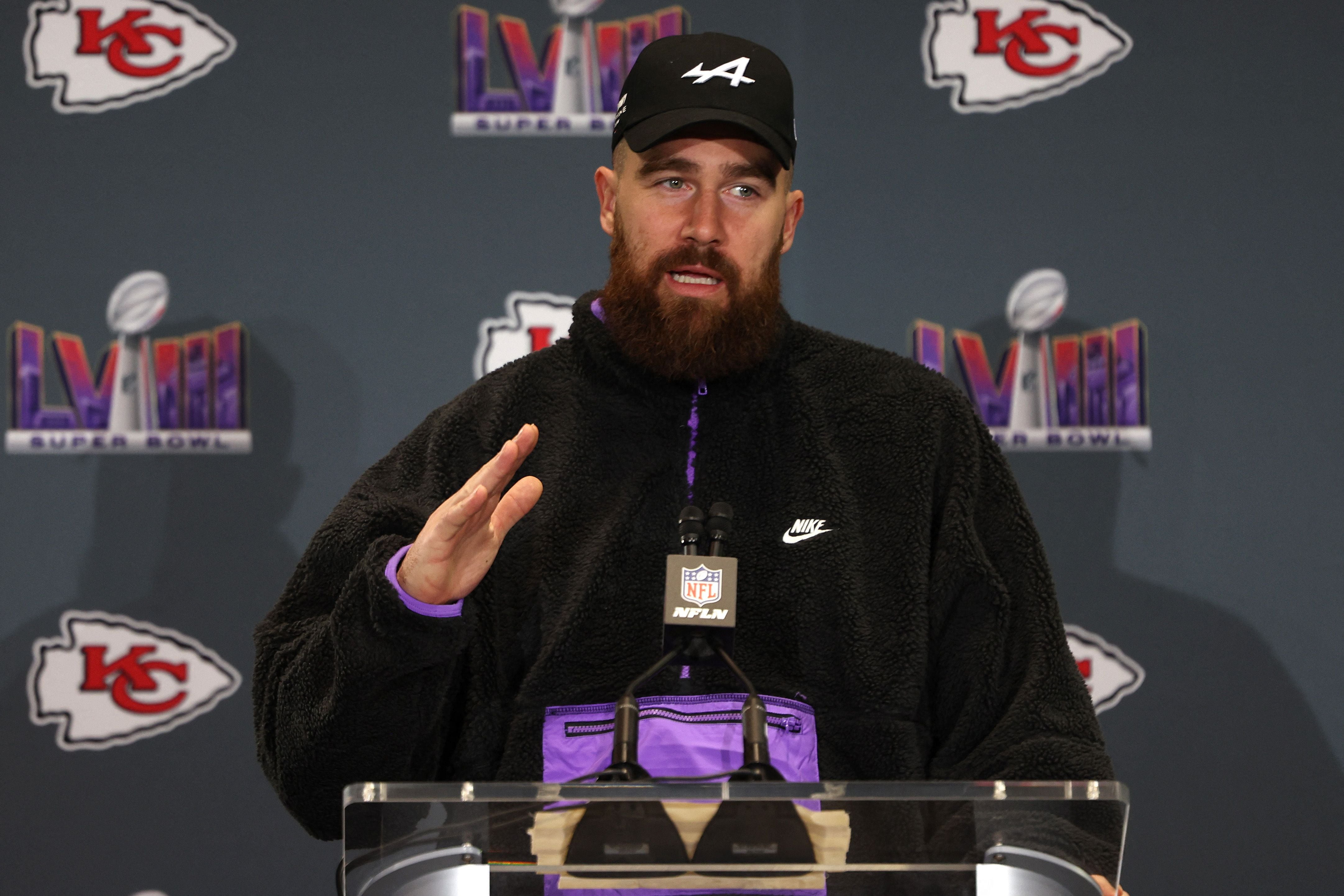 Watch: Awkward moment reporter tries to get Travis Kelce to sing “Karma”