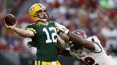 TAMPA, FLORIDA - SEPTEMBER 25: Aaron Rodgers #12 of the Green Bay Packers throws a pass with pressure from William Gholston #92 of the Tampa Bay Buccaneers during the fourth quarter in the game at Raymond James Stadium on September 25, 2022 in Tampa, Florida.   Douglas P. DeFelice/Getty Images/AFP