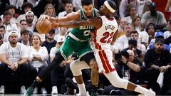 Miami Heat forward Jimmy Butler (R) defends Boston Celtics forward Jayson Tatum (L)