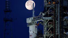 A full moon, known as the "Strawberry Moon" is shown with NASA's next-generation moon rocket, the Space Launch System (SLS) Artemis 1, at the Kennedy Space Center in Cape Canaveral, Florida.