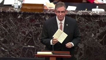 Attorney Bruce Castor, representing and defending former President Donald Trump, holds a copy of the US Constitution as he addresses the Senate. 
