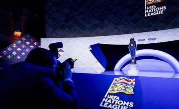 A photographer shoots the trophy  displayed prior to the draw for the second edition of the UEFA Nations League football tournament on March 3, 2020, in Amsterdam. 