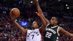 Apr 18, 2017; Toronto, Ontario, CAN;   Toronto Raptors guard Kyle Lowry (7) shoots for a basket as Milwaukee Bucks forward Khris Middleton (22) defends in the second half  in game two of the first round of the 2017 NBA Playoffs at Air Canada Centre. Manda