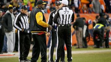 DENVER, CO - JANUARY 17: Head coach Mike Tomlin of the Pittsburgh Steelers argues a call with the referees against the Denver Broncos during the AFC Divisional Playoff Game at Sports Authority Field at Mile High on January 17, 2016 in Denver, Colorado.   