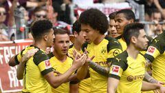 Dortmund&#039;s English midfielder Jadon Sancho is congratulated by teammates German midfielder Mario Goetze (2ndL) and Belgian midfielder Axel Witsel (3rdR) after he scored the first goal during the German first division Bundesliga football match SC Frei