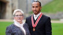 Lewis Hamilton poses with his mother Carmen Lockhart for a photo after he was made a Knight Bachelor by Britain&#039;s Charles, Prince of Wales, during an investiture ceremony at Windsor Castle in Windsor, Britain, December 15, 2021. Andrew Matthews/Pool 