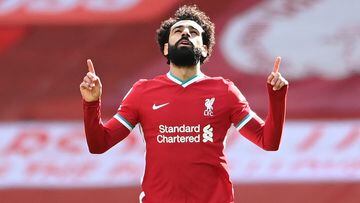 (FILES) In this file photo taken on April 10, 2021 Liverpool's Egyptian midfielder Mohamed Salah celebrates after scoring his team's first goal during the English Premier League football match between Liverpool and Aston Villa at Anfield in Liverpool, north west England. - Mohamed Salah ended speculation over his future by signing a new contract with Liverpool on Friday, July 1, that will reportedly run to 2025. The Egyptian, who has scored 156 goals in 254 appearances for the Reds, had entered the final year of his previous contract. (Photo by Laurence Griffiths / POOL / AFP) / RESTRICTED TO EDITORIAL USE. No use with unauthorized audio, video, data, fixture lists, club/league logos or 'live' services. Online in-match use limited to 120 images. An additional 40 images may be used in extra time. No video emulation. Social media in-match use limited to 120 images. An additional 40 images may be used in extra time. No use in betting publications, games or single club/league/player publications. / 